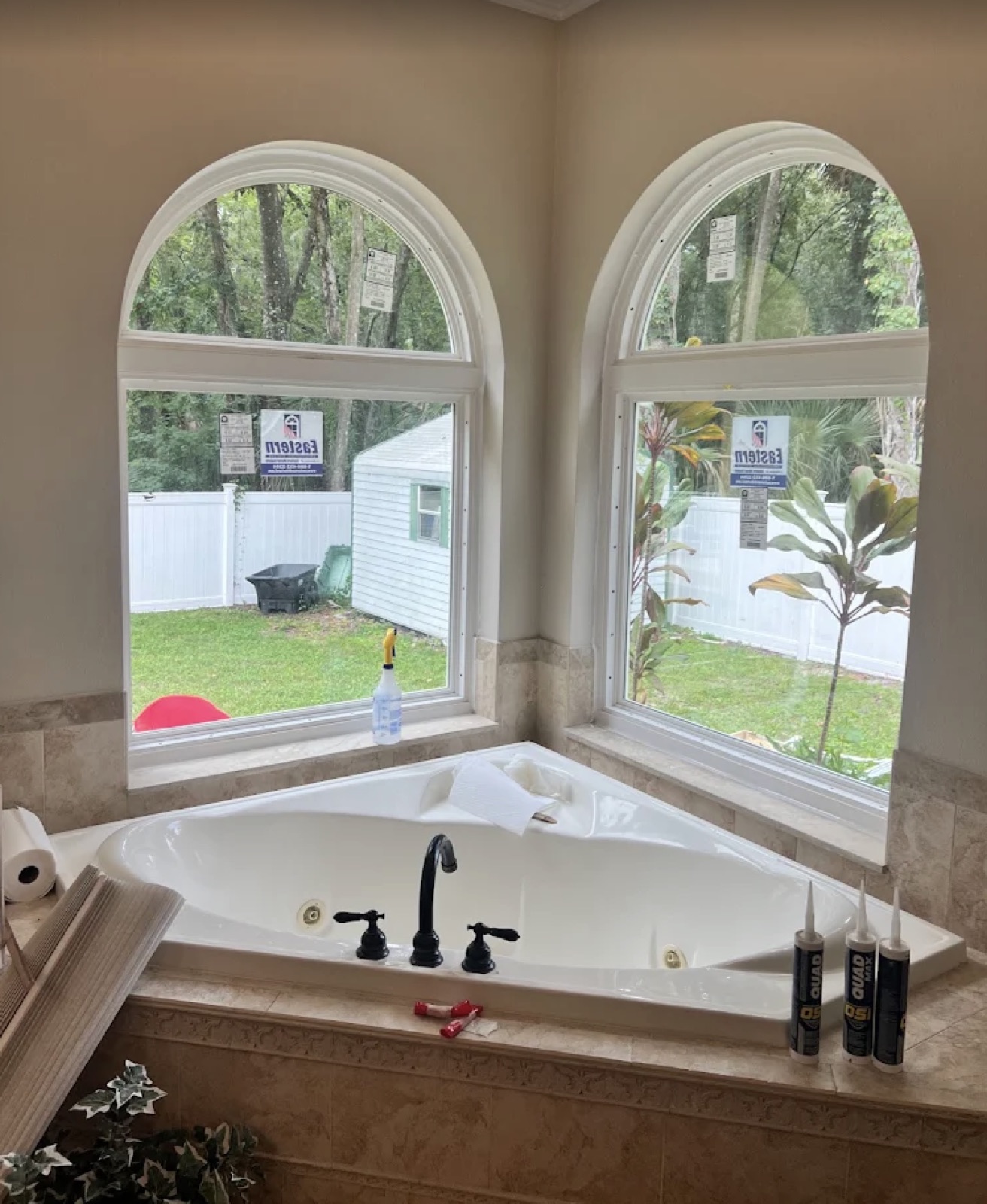 Arched window repair and seal replacement above a bathtub in a Fort Myers home